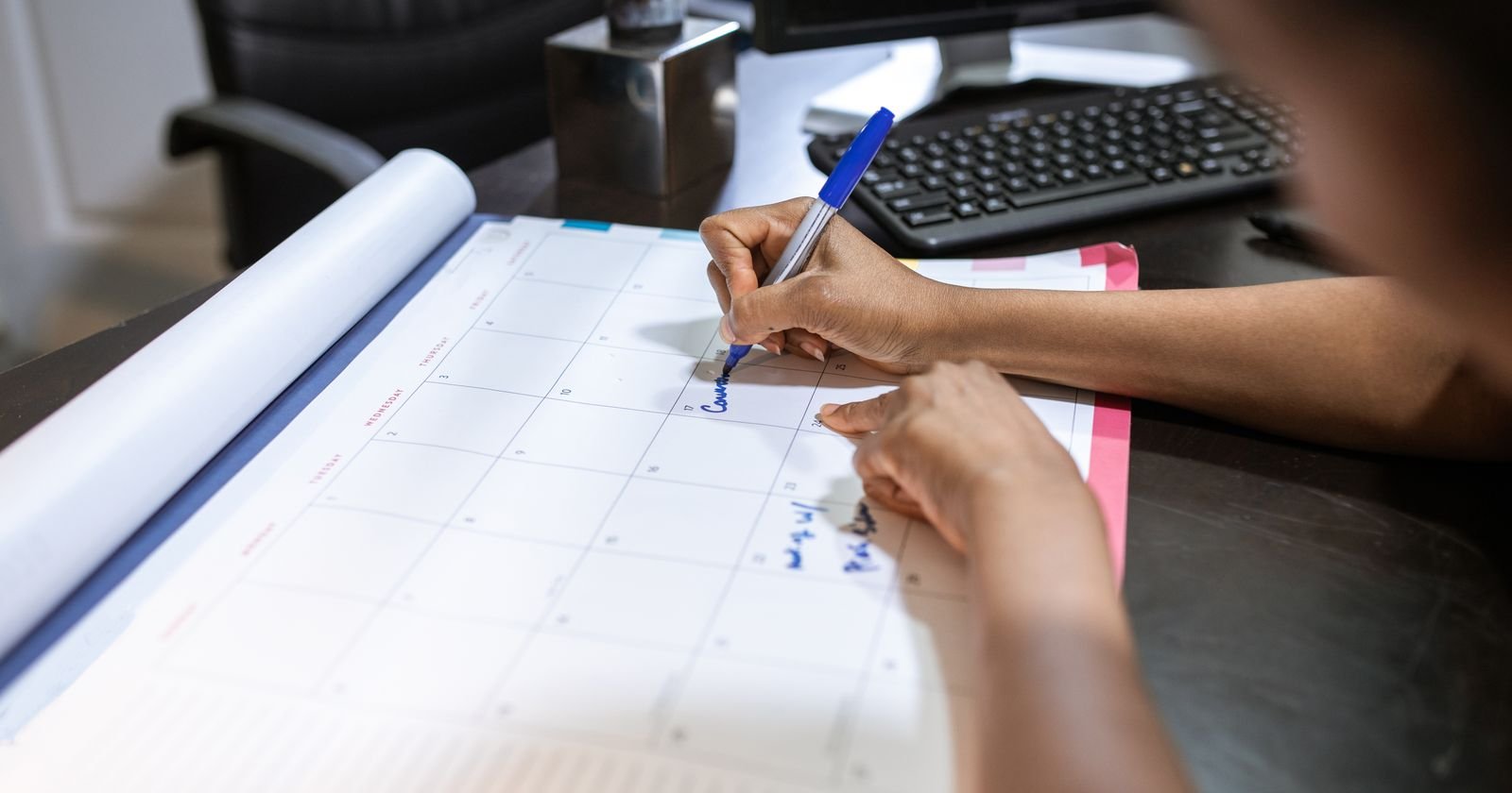 Person marking dates on a desk calendar, representing juvenile hall abuse deadlines in California