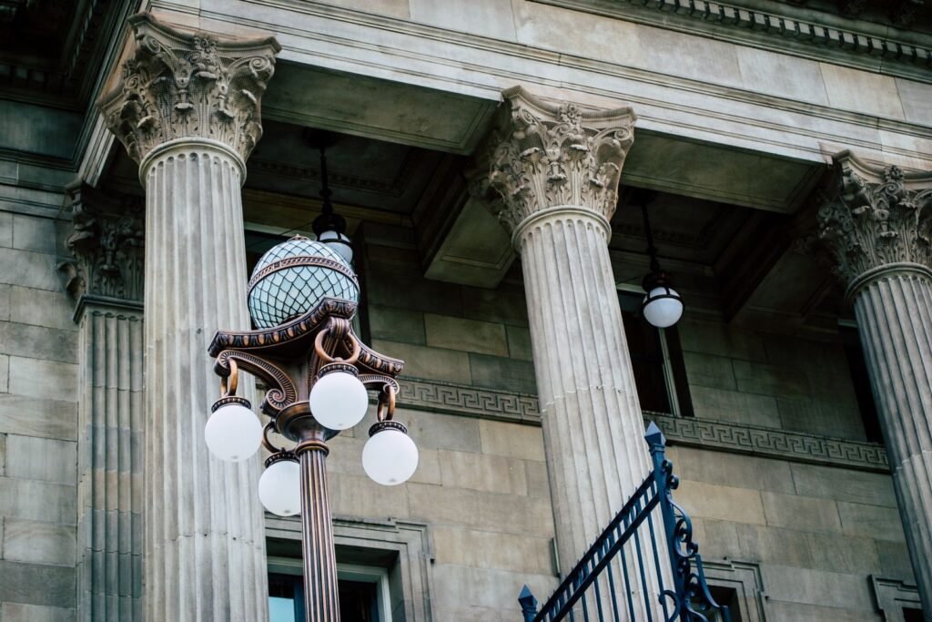 Classic stone columns and a street lamp outside a courthouse, where a Maryland sex abuse lawsuit may be heard