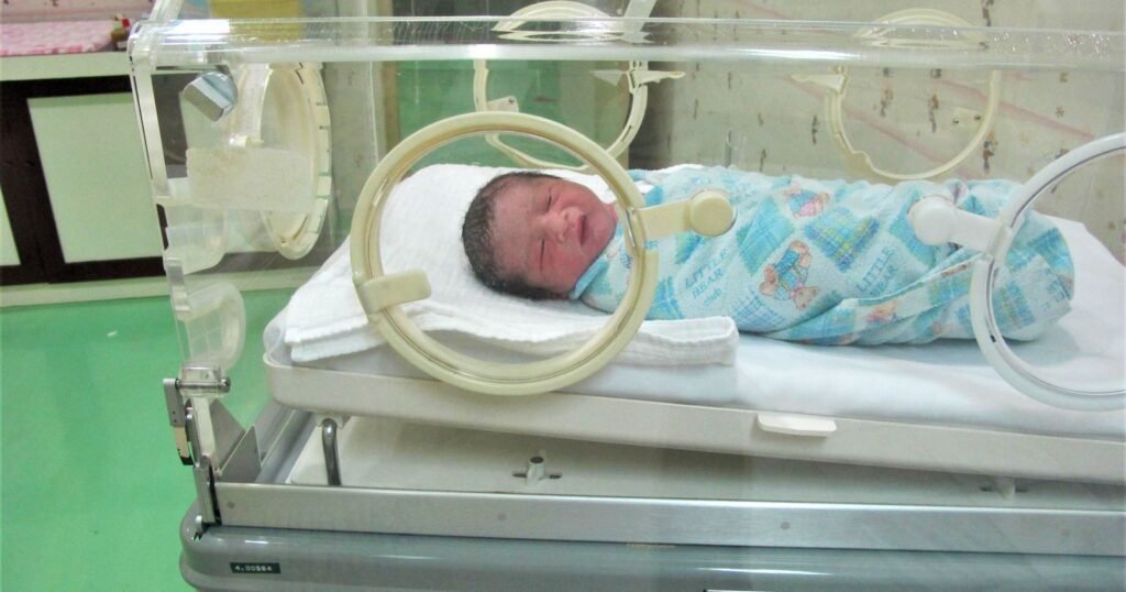 Premature newborn in a hospital incubator in the NICU