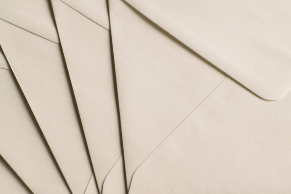 Stack of plain beige envelopes, like the notification letters mailed to people who may have been recorded