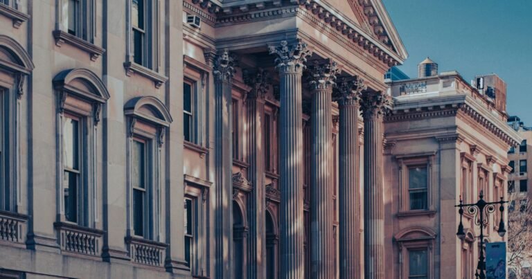 Columned facade of a historic courthouse in Lower Manhattan, representing an NYC institutional abuse lawsuit