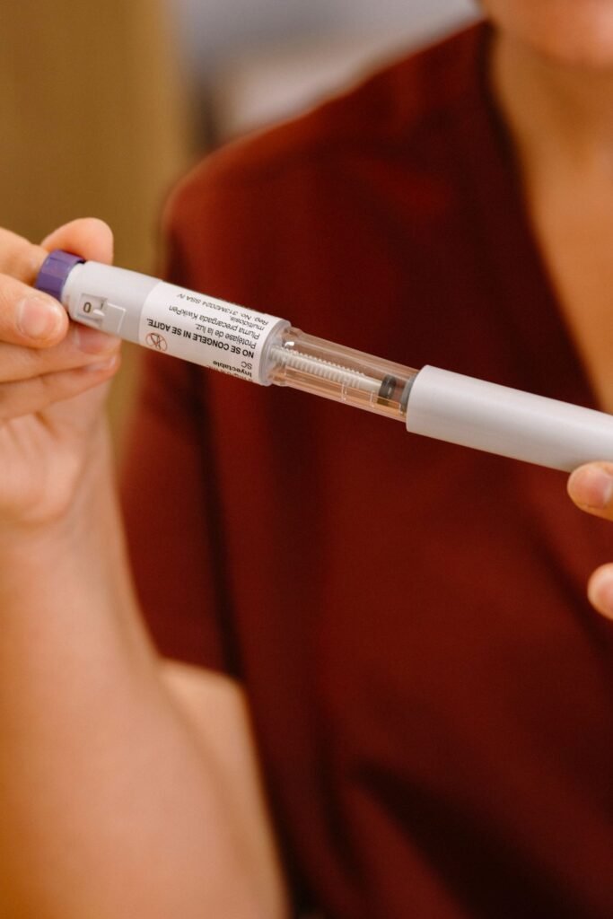 Ozempic gastroparesis lawsuit: close-up of a person using a weight loss injection pen