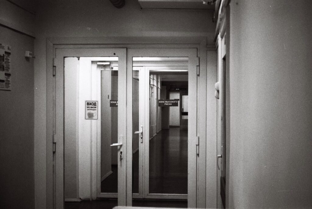 Empty institutional corridor with open doors, illustrating the setting behind a Polinsky Children's Center lawsuit