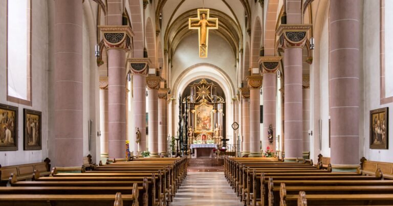 Empty church interior with wooden pews, illustrating a Rhode Island diocese lawsuit