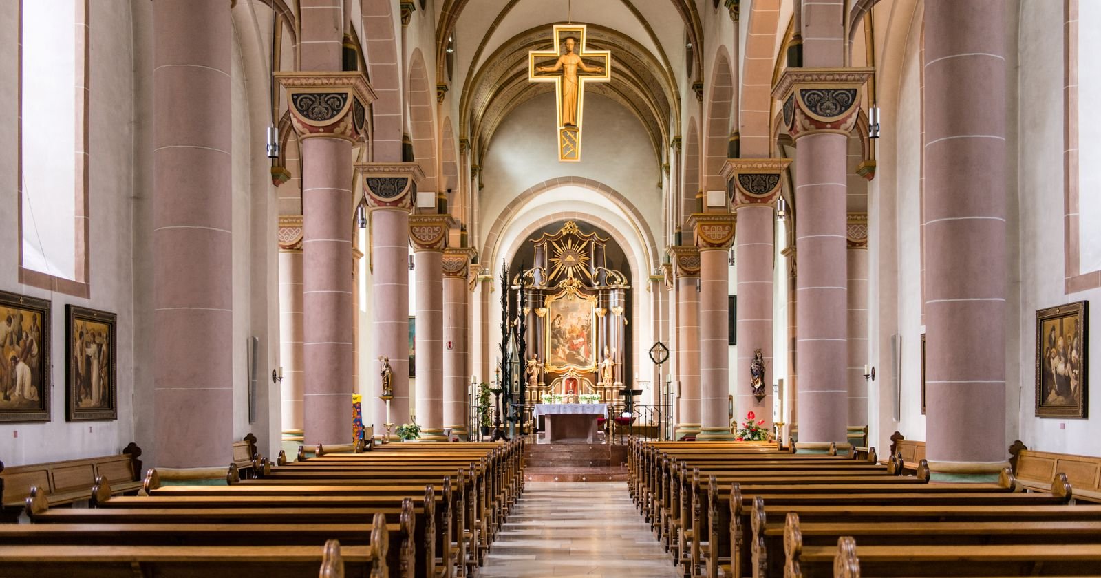 Empty church interior with wooden pews, illustrating a Rhode Island diocese lawsuit