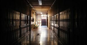 Empty school hallway with lockers, illustrating evidence in California school abuse lawsuits