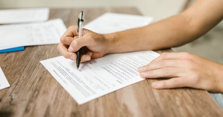 Person filling out a Social Security disability application form to check SSDI eligibility