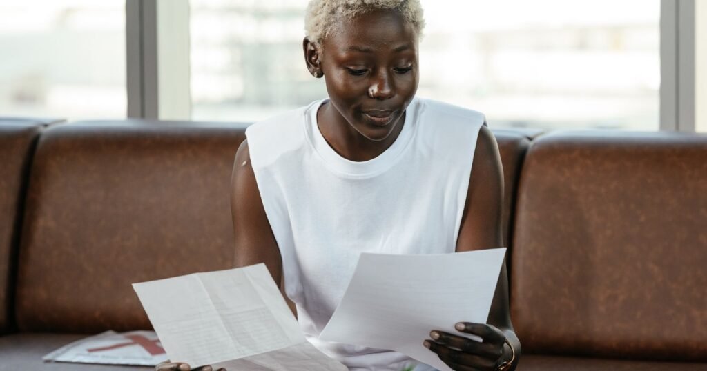Woman reviewing medical and purchase records to organize talcum powder lawsuit evidence