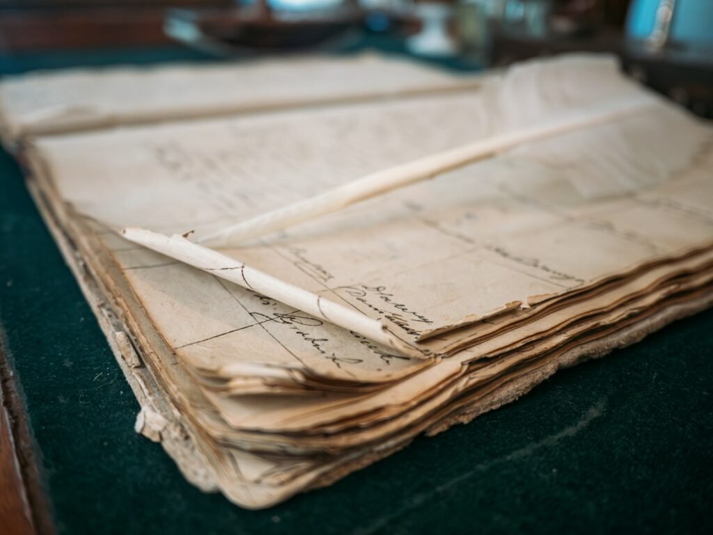 Open ledger with handwritten notes, like a written record of talc legacy exposure over the years