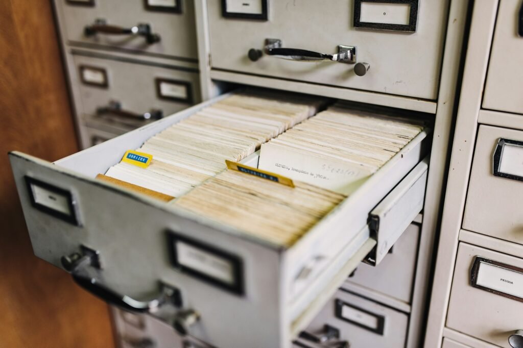 Wooden file cabinet drawer of index cards, representing organized medical and product records