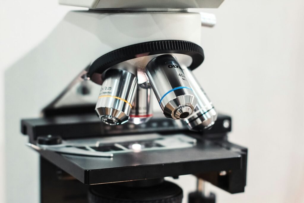 Close-up of a laboratory microscope on a table