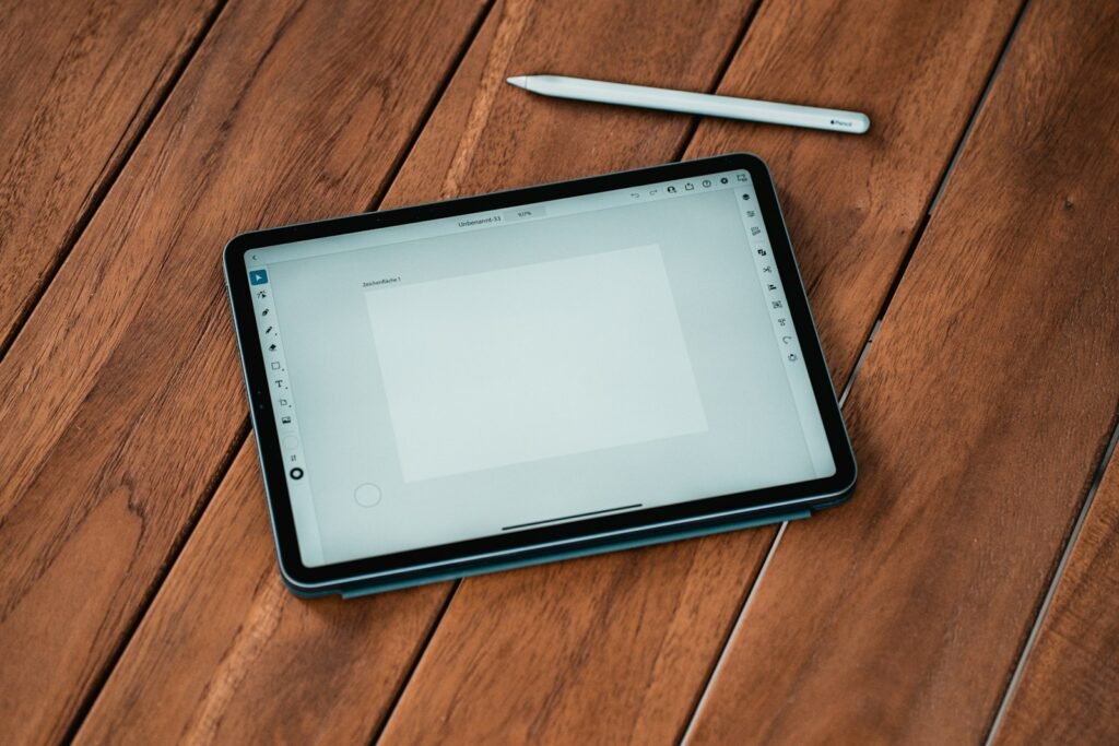 Tablet with a stylus on a wooden table, a common device in families following the Roblox lawsuit