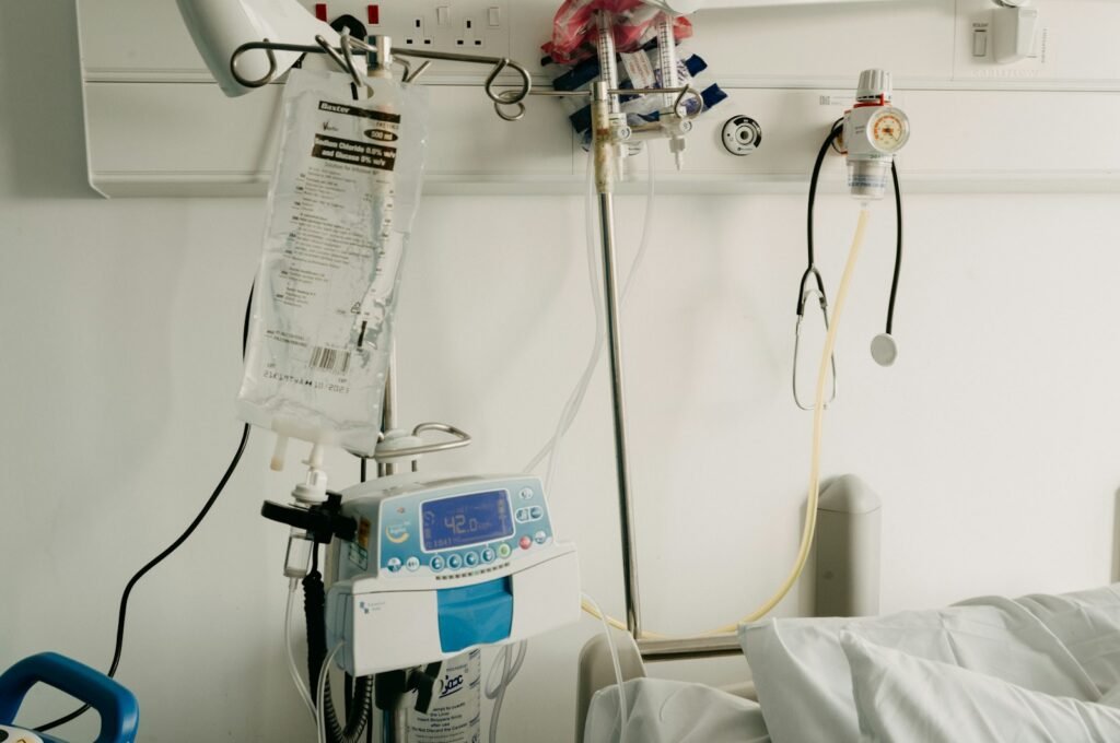 Hospital room with a bed and monitors, where records for a transvaginal mesh lawsuit review often begin