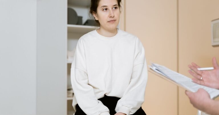 Woman discussing her transvaginal mesh lawsuit deadline and medical history with a doctor during a clinic consultation