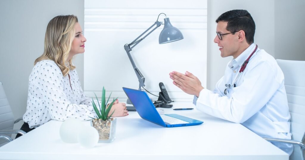 Woman discussing transvaginal mesh complications with her doctor