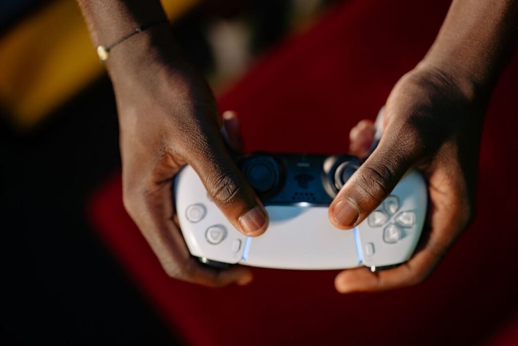 Video game addiction lawsuit status: close-up of hands holding a wireless game controller
