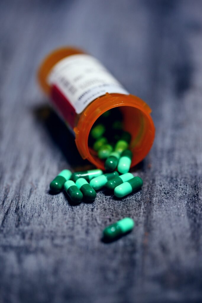 Prescription medication bottle on a plain surface, representing pharmacy fill records