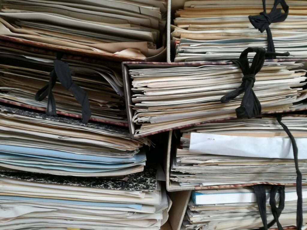 Rows of brown binders on library shelves