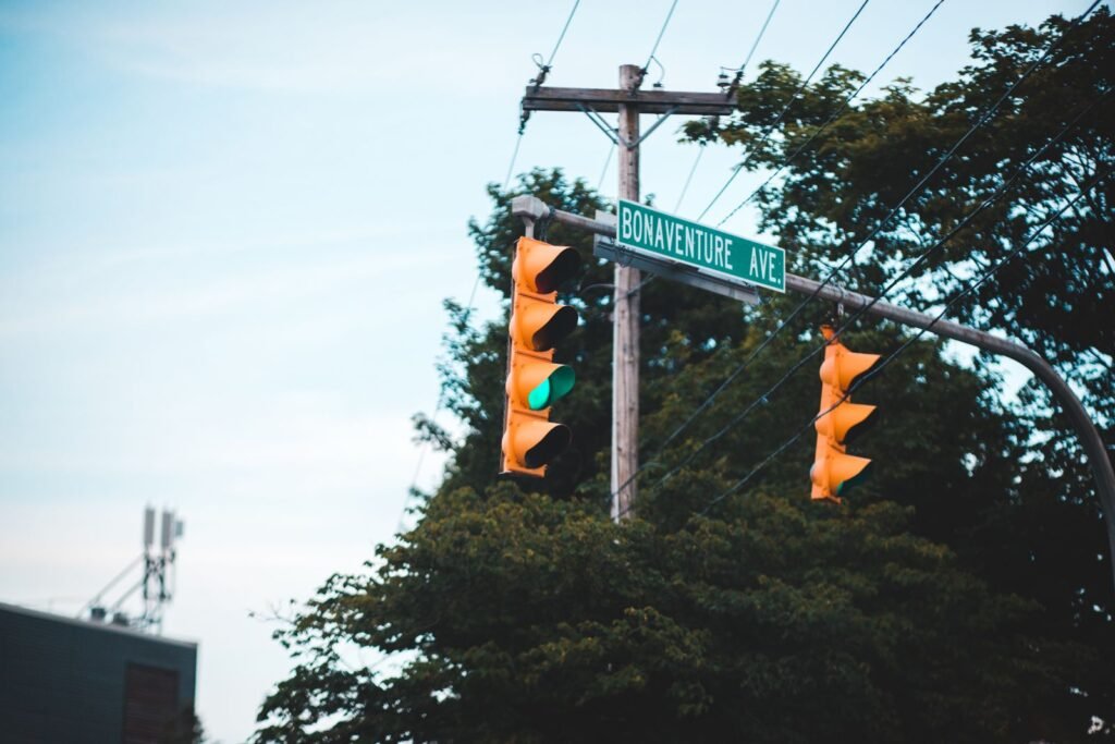 Traffic light and street signs at an intersection where car accident liability often depends on right of way