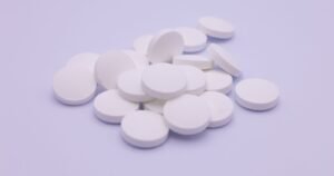 Pile of white medication tablets, illustrating Zantac lawsuit eligibility and proof of use